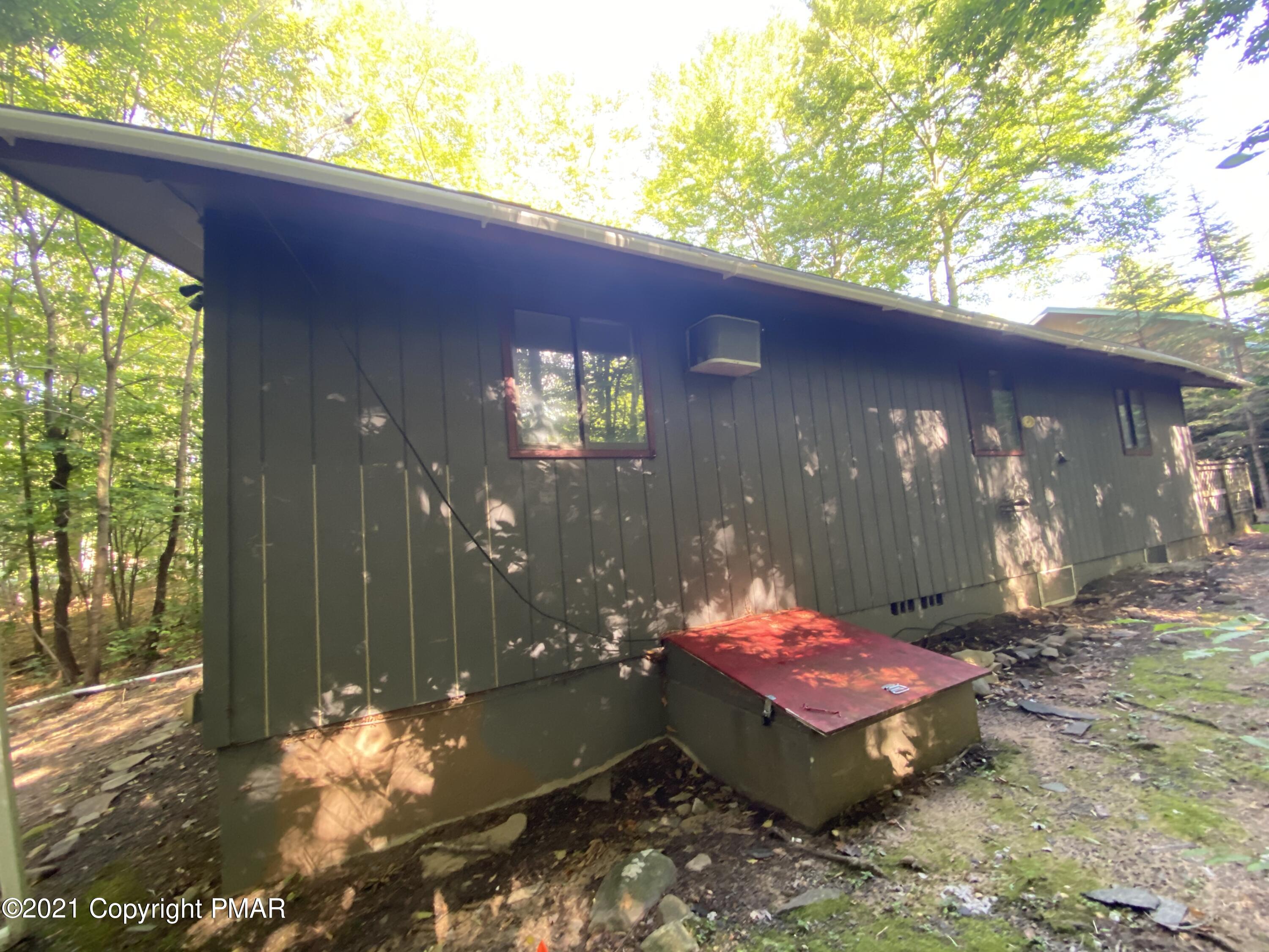 1194 Deer Run Pocono Pines, PA 18350 - Photo 2 of 14 a view of a backyard of the house