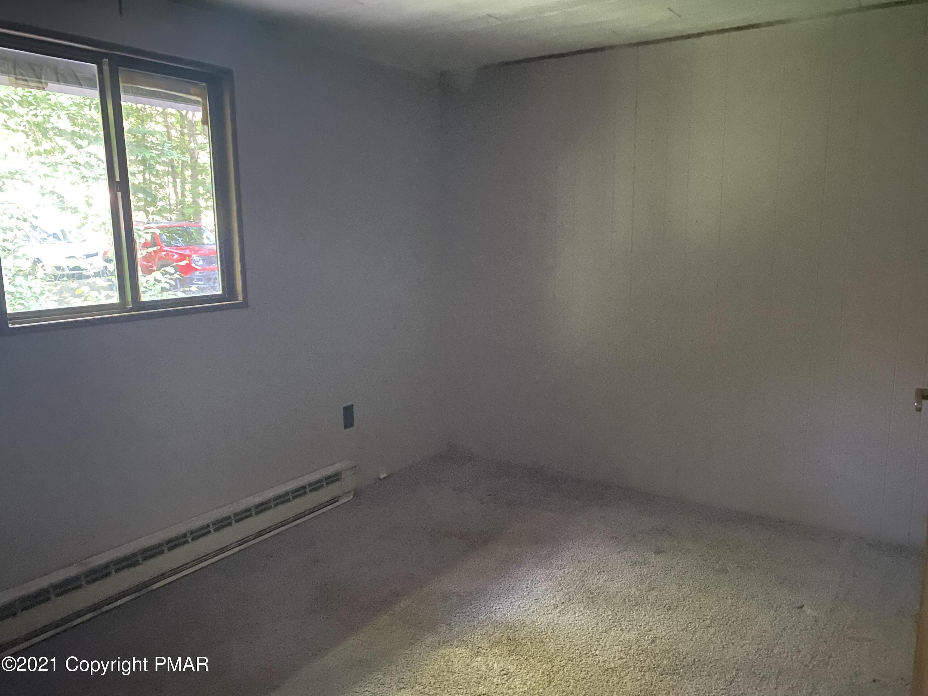 1194 Deer Run Pocono Pines, PA 18350 - Photo 4 of 14 an empty room with a window