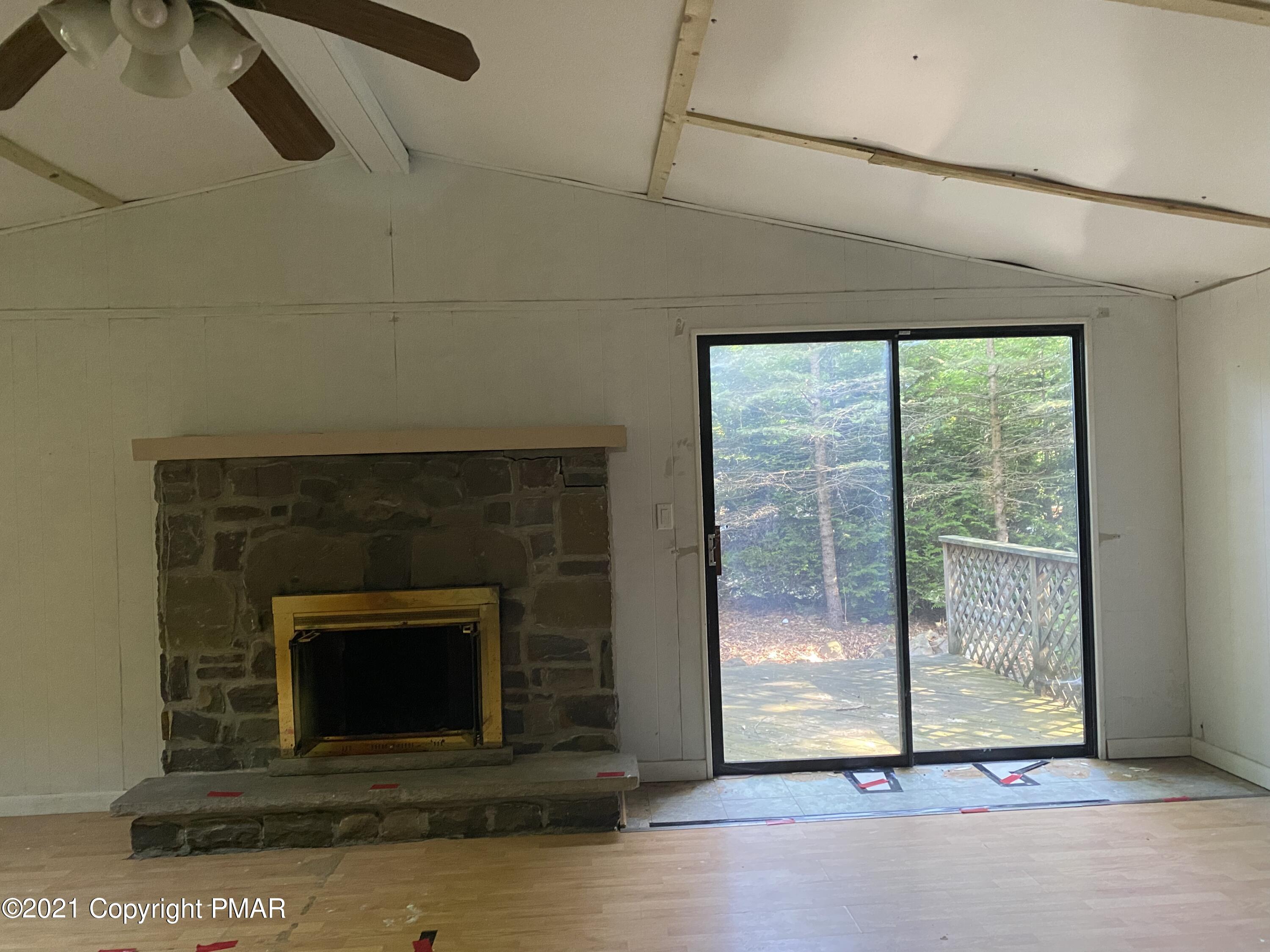 1194 Deer Run Pocono Pines, PA 18350 - Photo 9 of 14 a living room with a fireplace