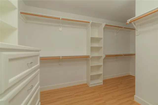 a view of an empty walk in closet