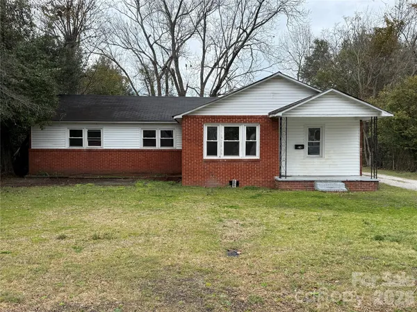 a house with trees in the background