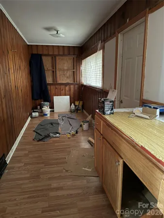 a room with sink mirror and window