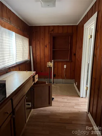 a kitchen with a refrigerator and a sink