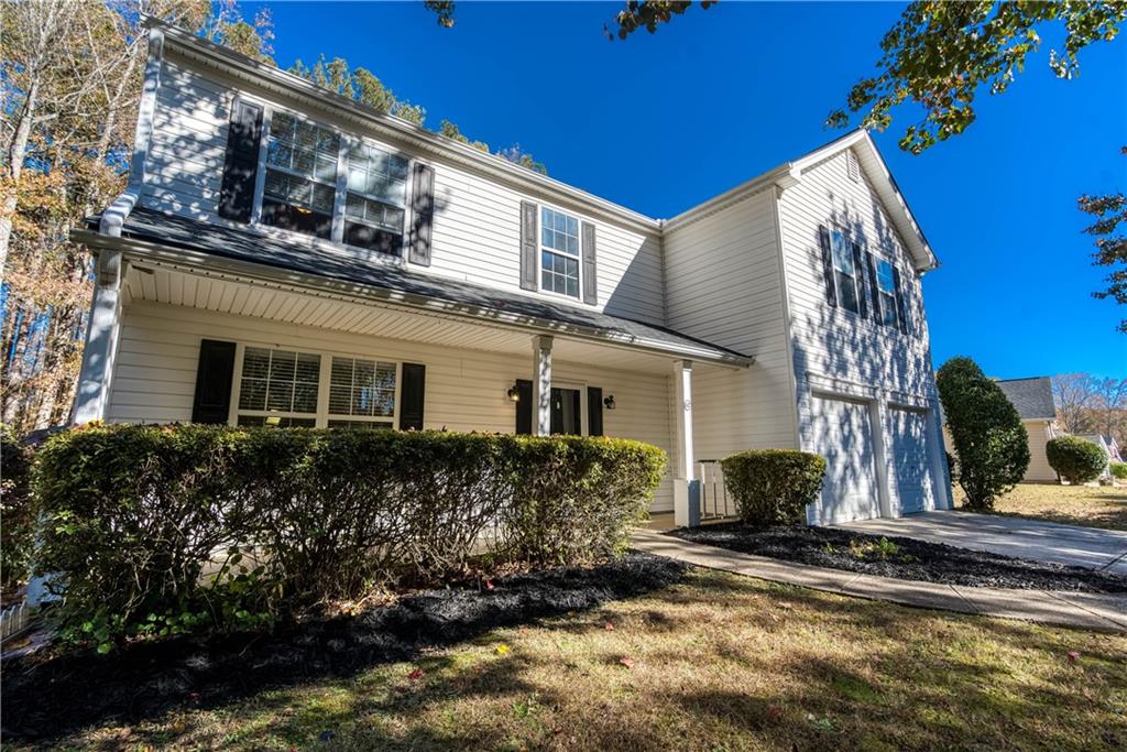 a view of a house with a yard