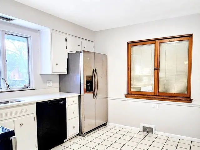 a kitchen with stainless steel appliances a refrigerator and a sink
