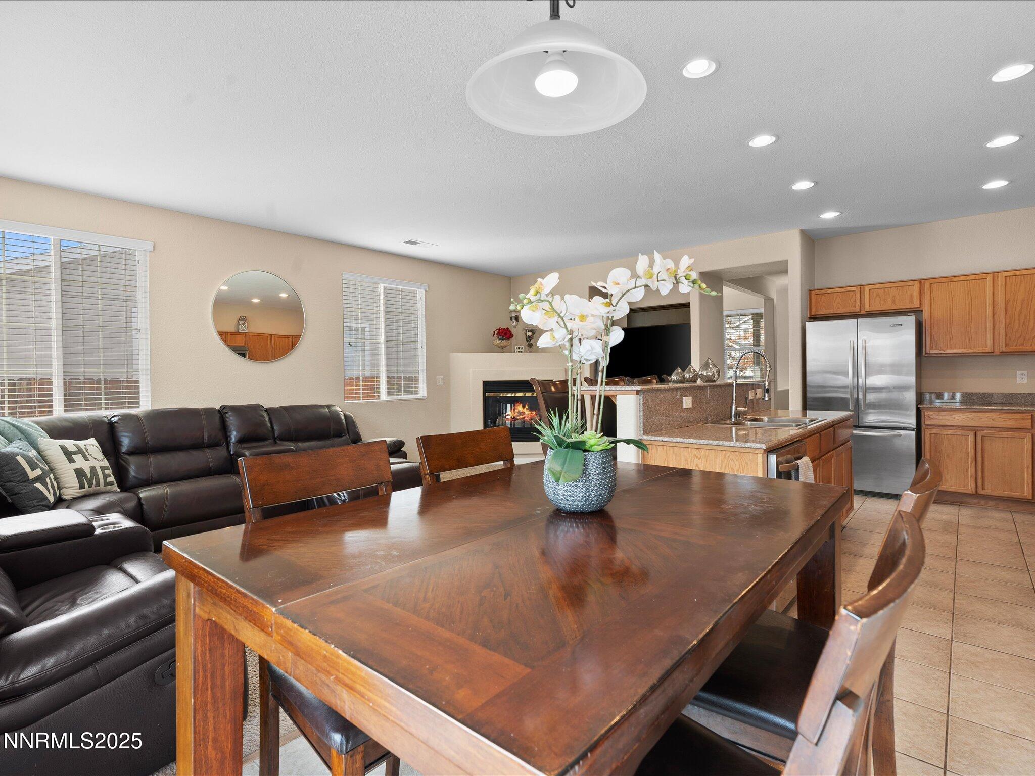 8934 Sorcha Street Reno, NV 89506 - Photo 15 of 60 a living room with fireplace furniture and a wooden floor