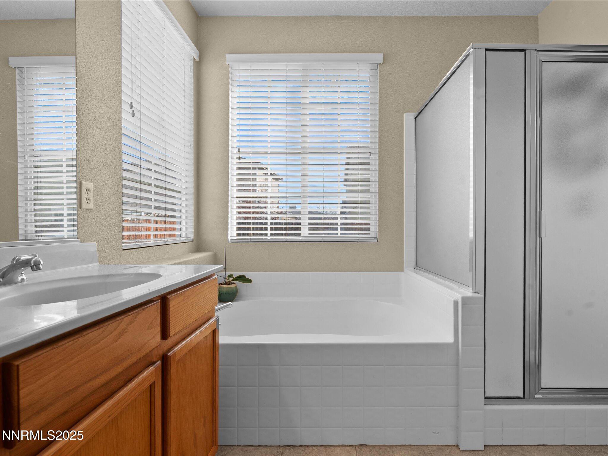 8934 Sorcha Street Reno, NV 89506 - Photo 28 of 60 a bathroom with a bathtub and a sink