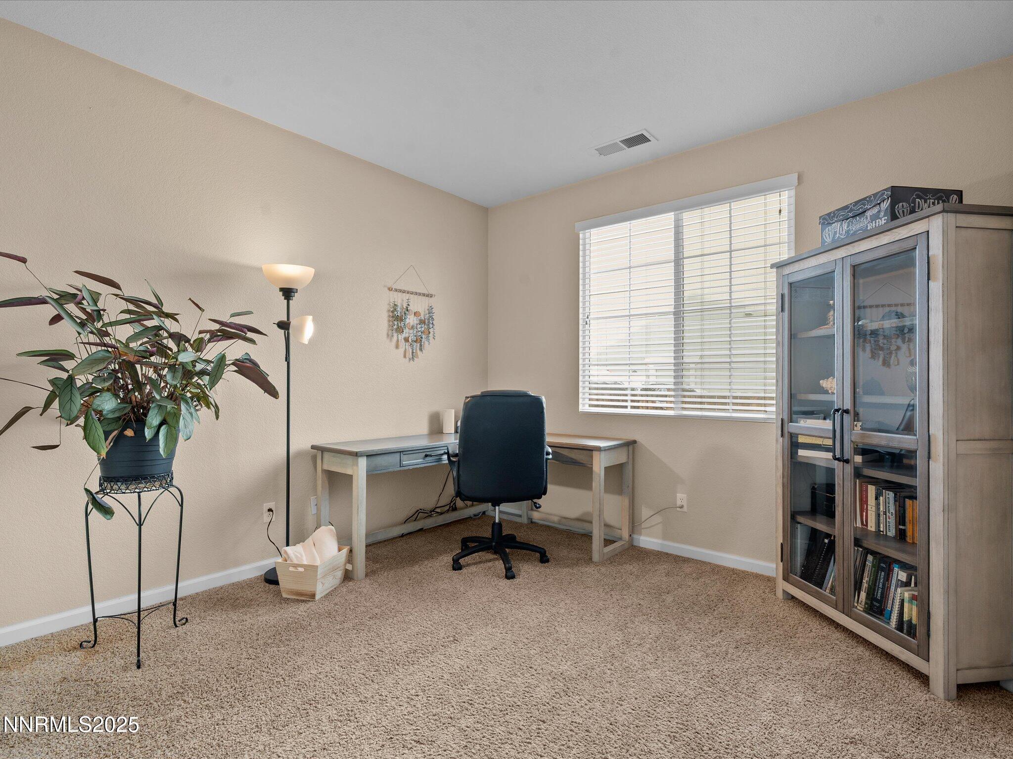 8934 Sorcha Street Reno, NV 89506 - Photo 30 of 60 a view of a workspace with furniture and a window