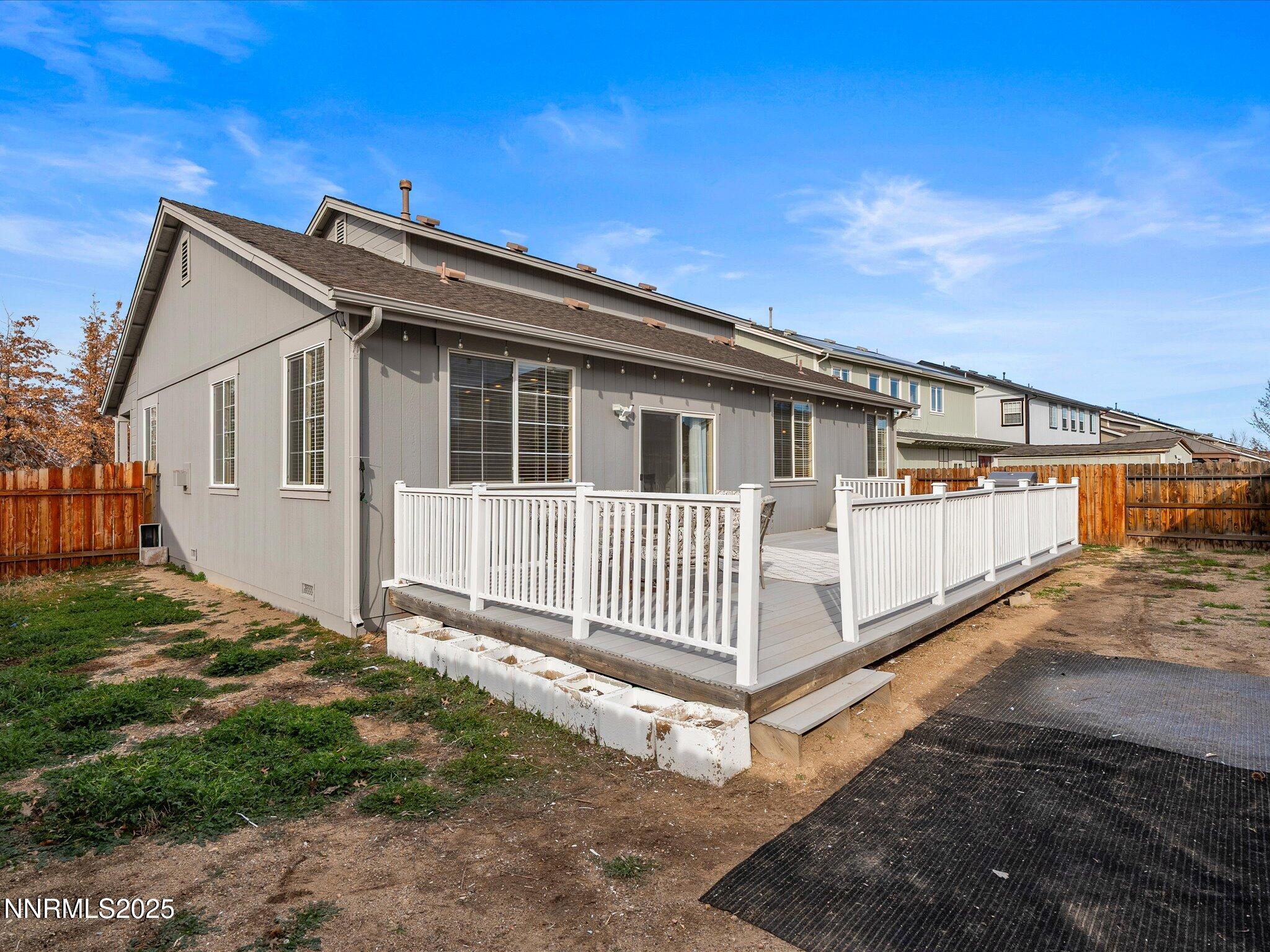 8934 Sorcha Street Reno, NV 89506 - Photo 48 of 60 a view of a house with wooden fence