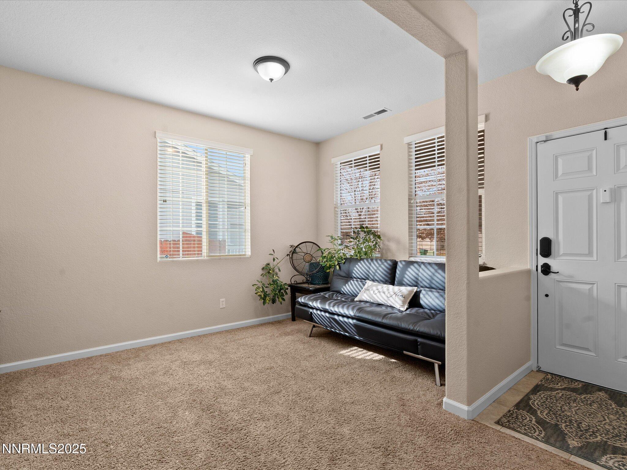 8934 Sorcha Street Reno, NV 89506 - Photo 5 of 60 a living room with furniture and windows