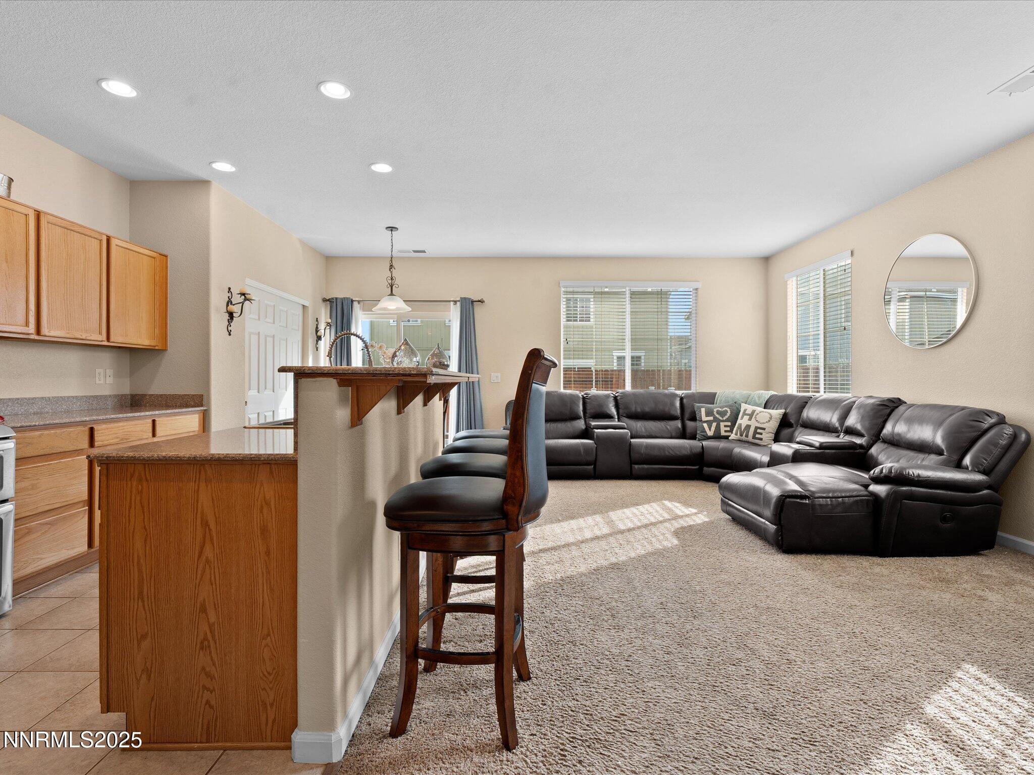 8934 Sorcha Street Reno, NV 89506 - Photo 9 of 60 a living room with furniture a wooden floor and a window