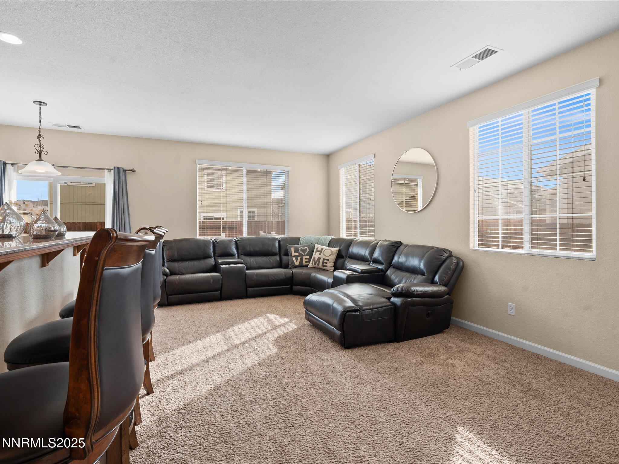 8934 Sorcha Street Reno, NV 89506 - Photo 10 of 60 a living room with furniture window and a lamp