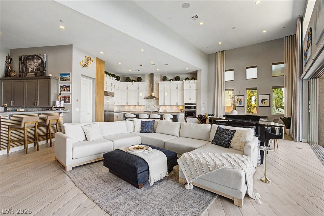 6014 Willow Ridge Court Las Vegas, NV 89135 - Photo 18 of 99 This open concept living area boasts soaring ceilings and ample natural light, perfect for entertaining.