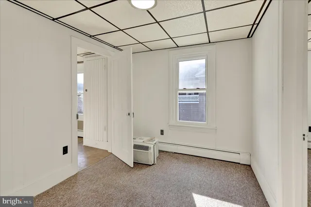 a view of a livingroom with an empty space and window