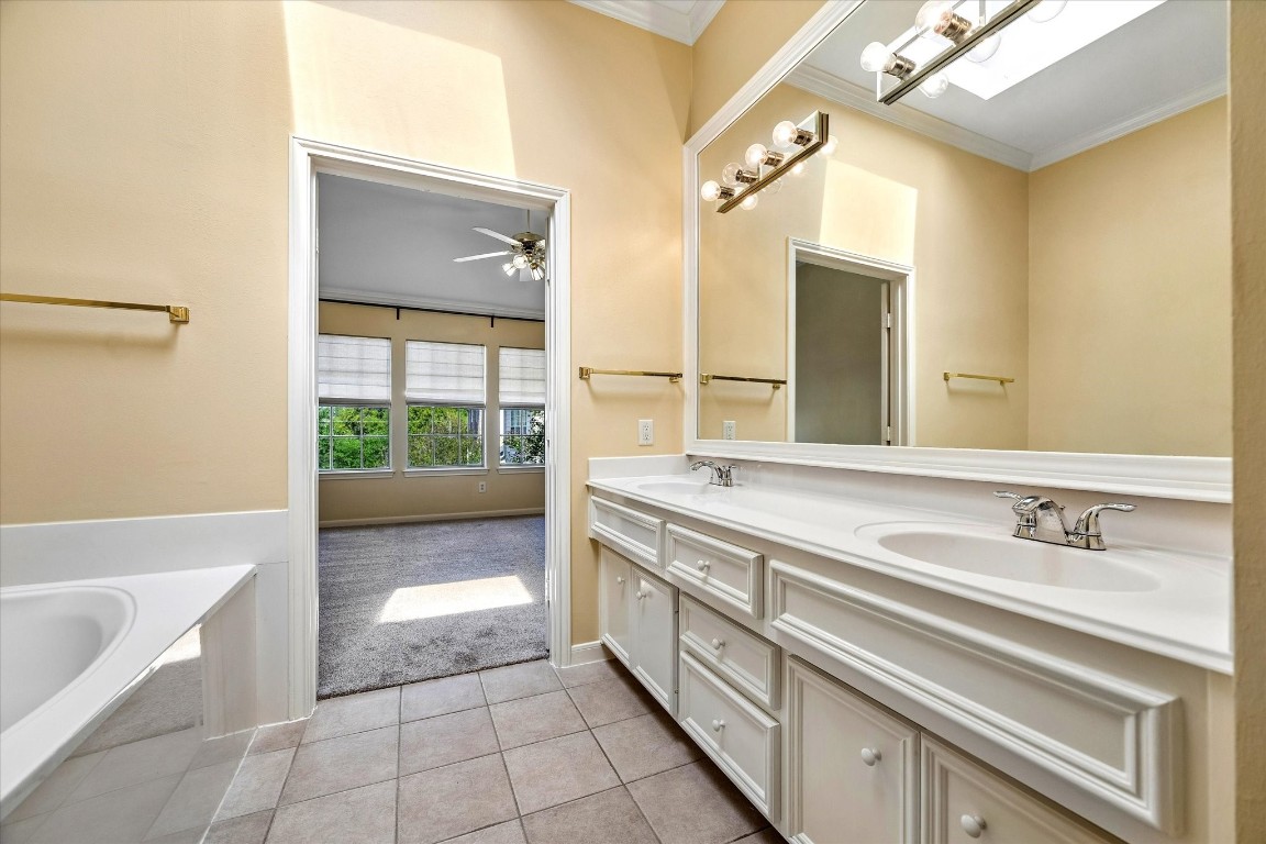 2915 Jackson Street Houston, TX 77004 - Photo 13 of 23 a spacious bathroom with a tub sink and mirror