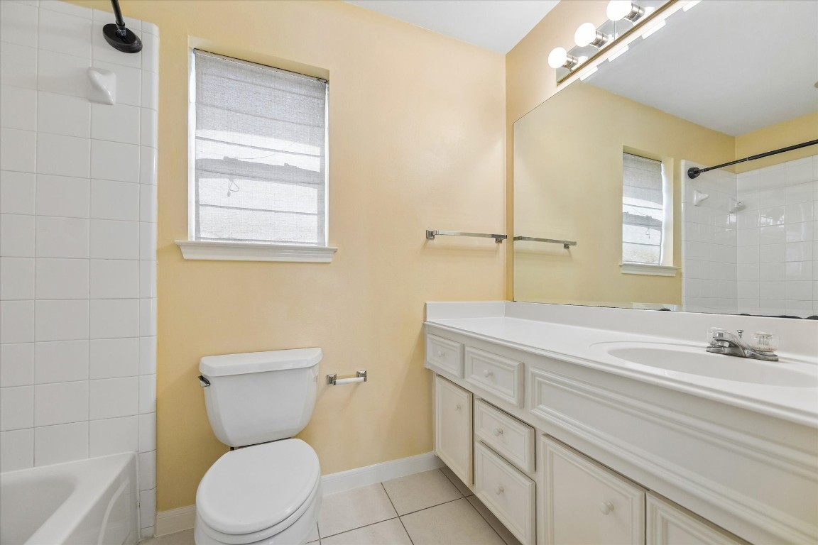 2915 Jackson Street Houston, TX 77004 - Photo 17 of 23 a bathroom with a toilet sink and mirror
