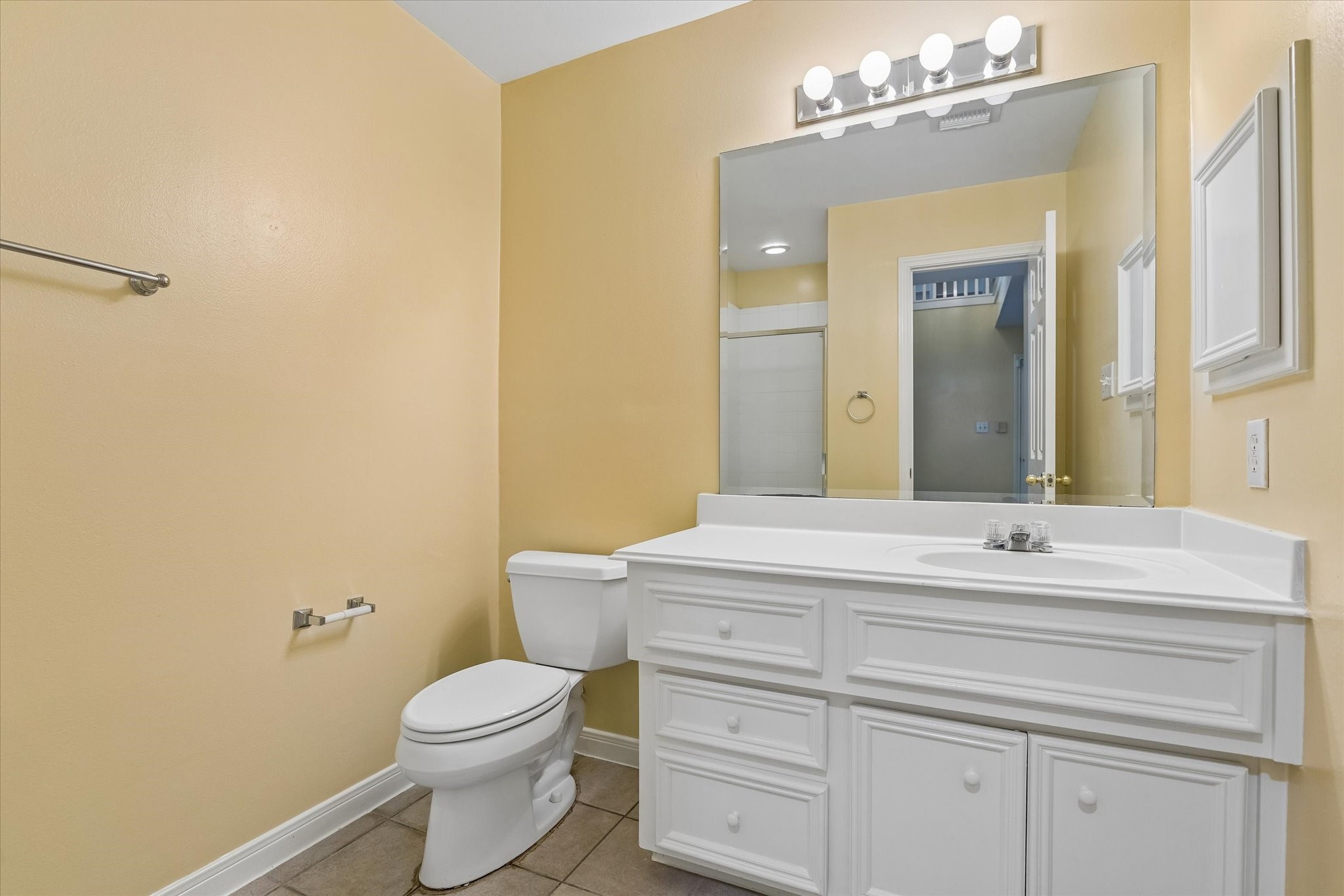 2915 Jackson Street Houston, TX 77004 - Photo 18 of 23 a bathroom with a sink mirror vanity and toilet