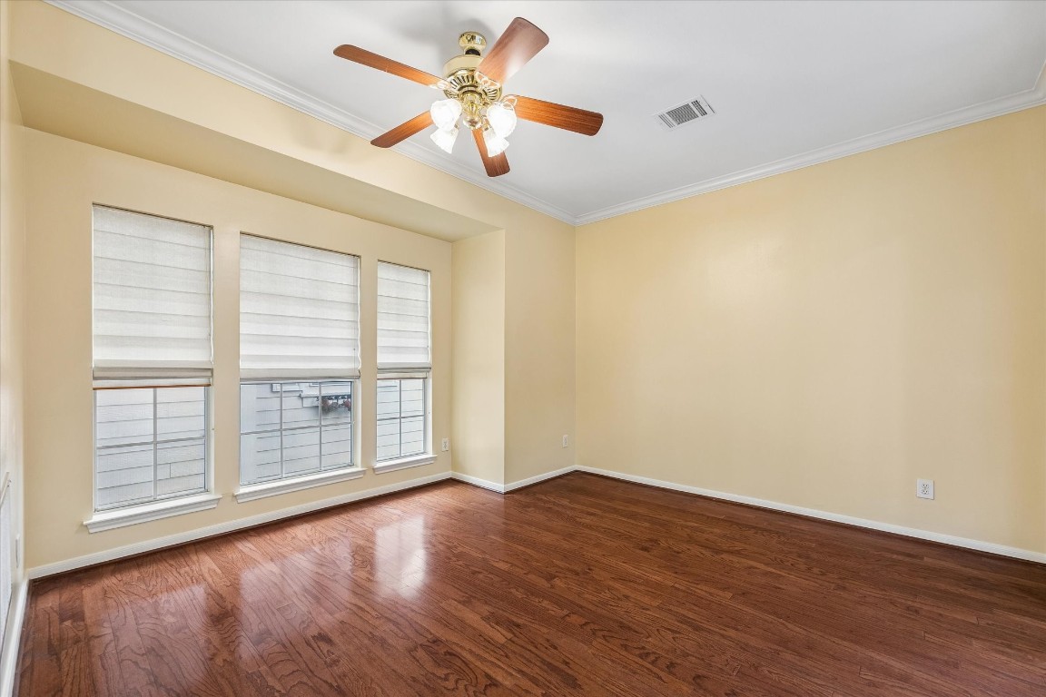 2915 Jackson Street Houston, TX 77004 - Photo 8 of 23 a view of an empty room with wooden floor and a window