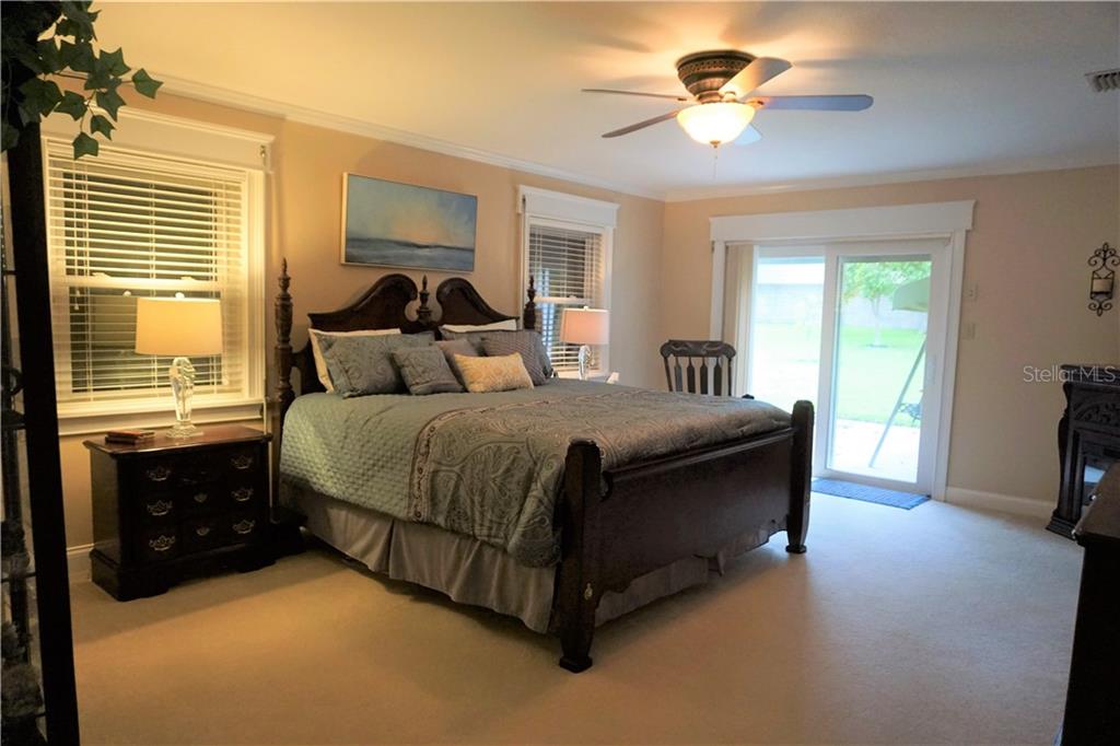 1823 South Valrico Road Valrico, FL 33596 - Photo 22 of 49 Master suite with sliding glass door leading out to a small patio.