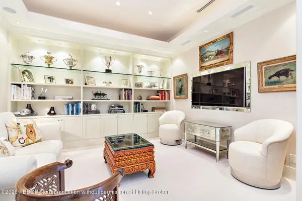 a living room with furniture and a lamp