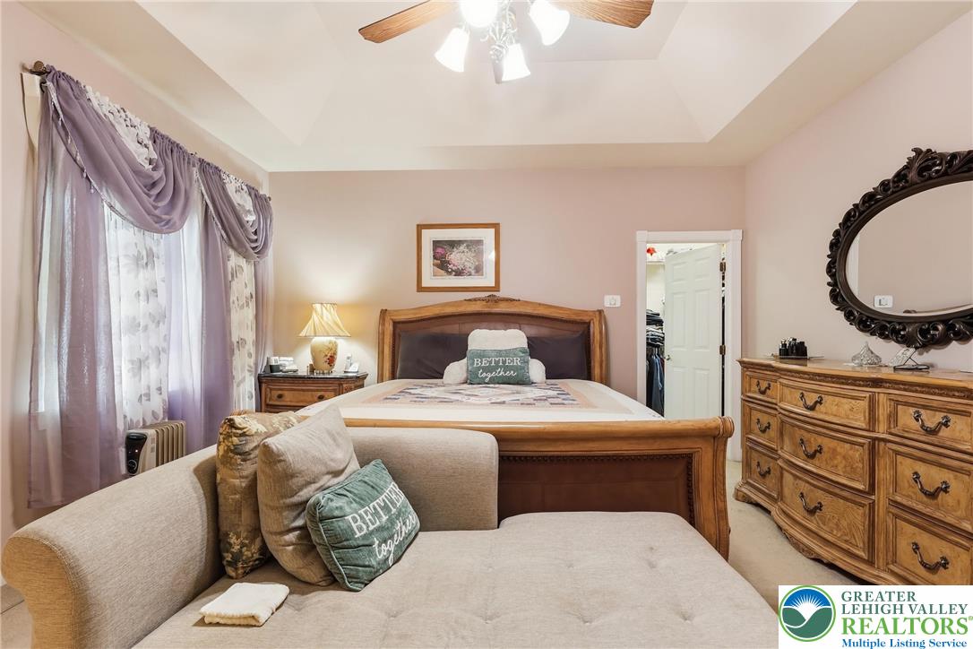 5217 Cider Press Road Schnecksville, PA 18078 - Photo 25 of 54 a bedroom with a bed and a dresser