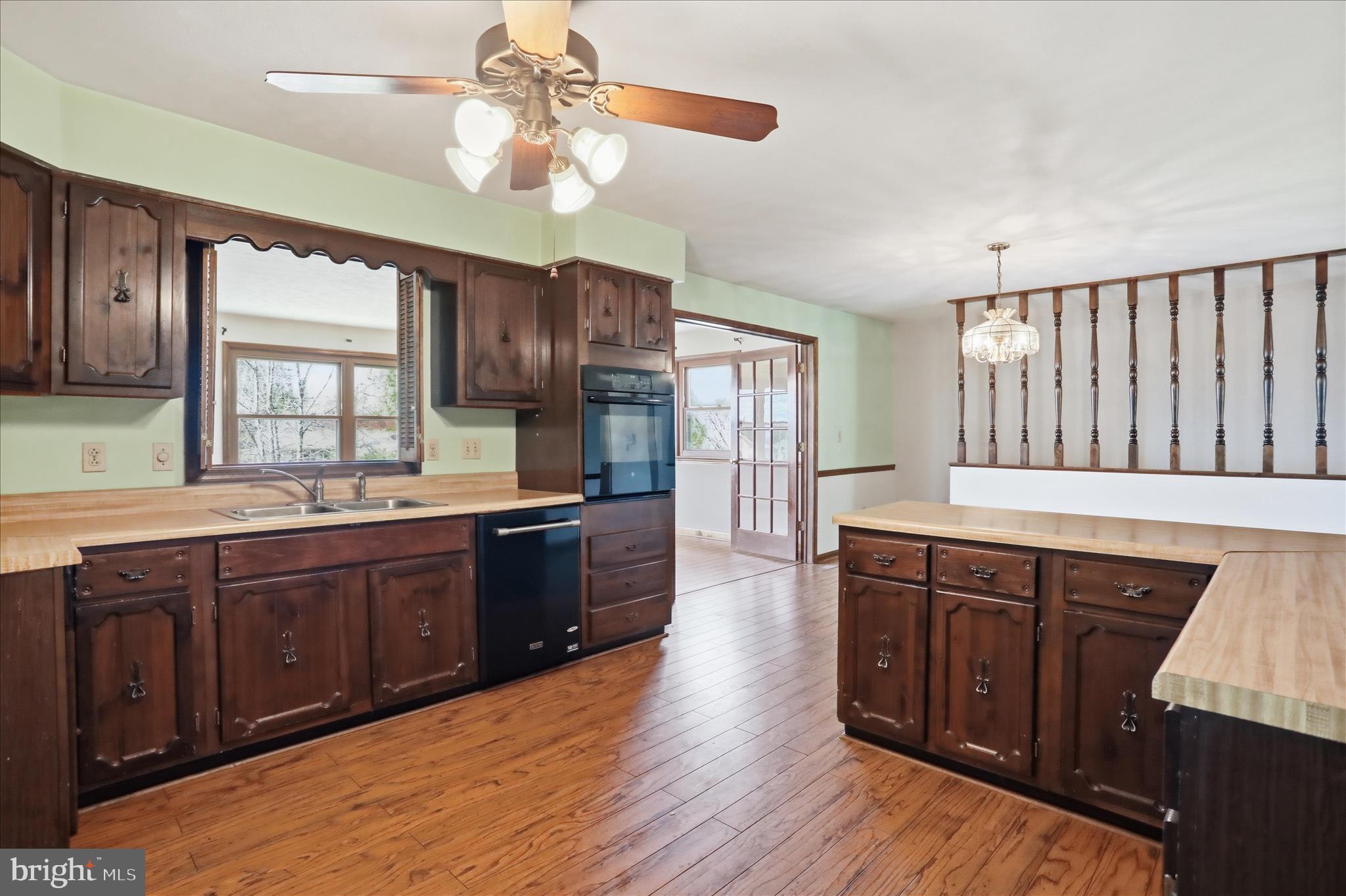 20 Gloucester Road Front Royal, VA 22630 - Photo 11 of 43 a kitchen with stainless steel appliances granite countertop wooden cabinets a sink dishwasher a stove and a refrigerator with wooden floor