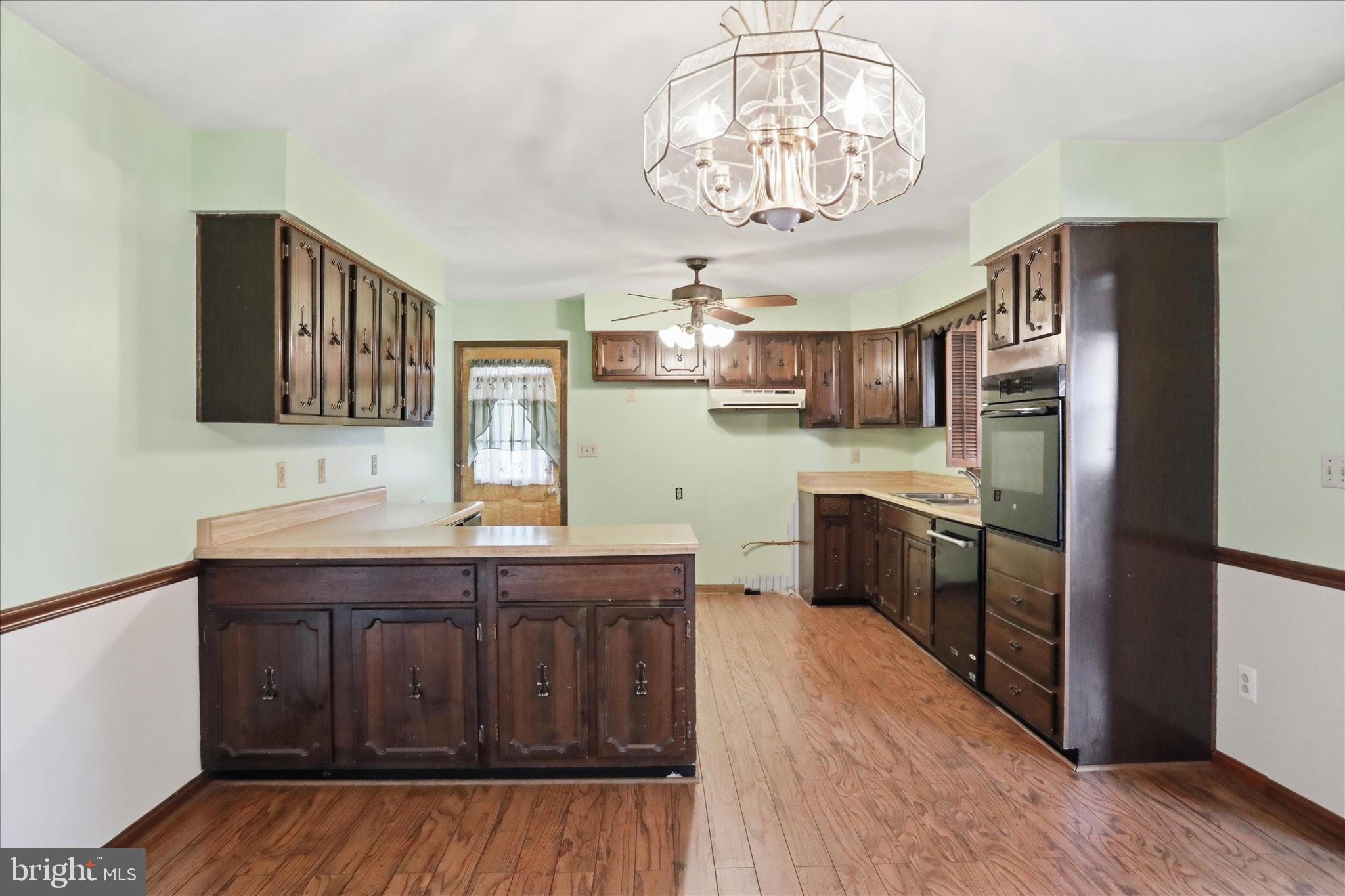 20 Gloucester Road Front Royal, VA 22630 - Photo 17 of 43 a kitchen with stainless steel appliances a table and window