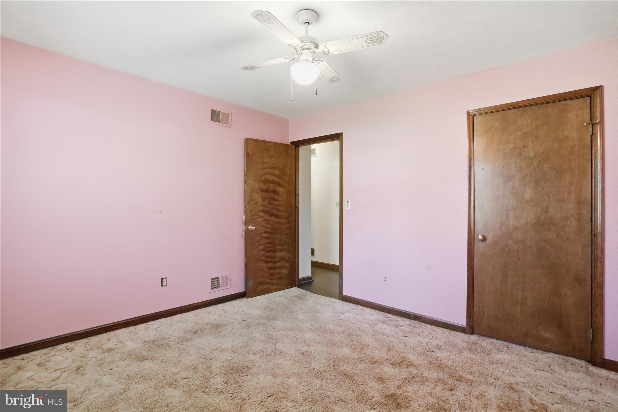 20 Gloucester Road Front Royal, VA 22630 - Photo 27 of 43 an empty room with a ceiling fan and a window