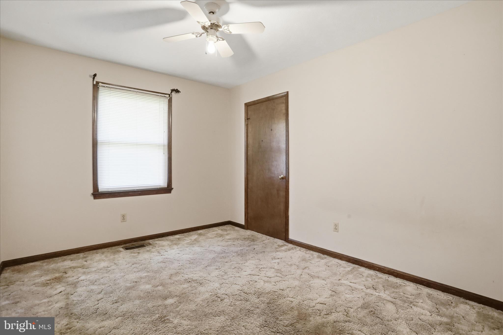 20 Gloucester Road Front Royal, VA 22630 - Photo 28 of 43 an empty room with a window and a fan