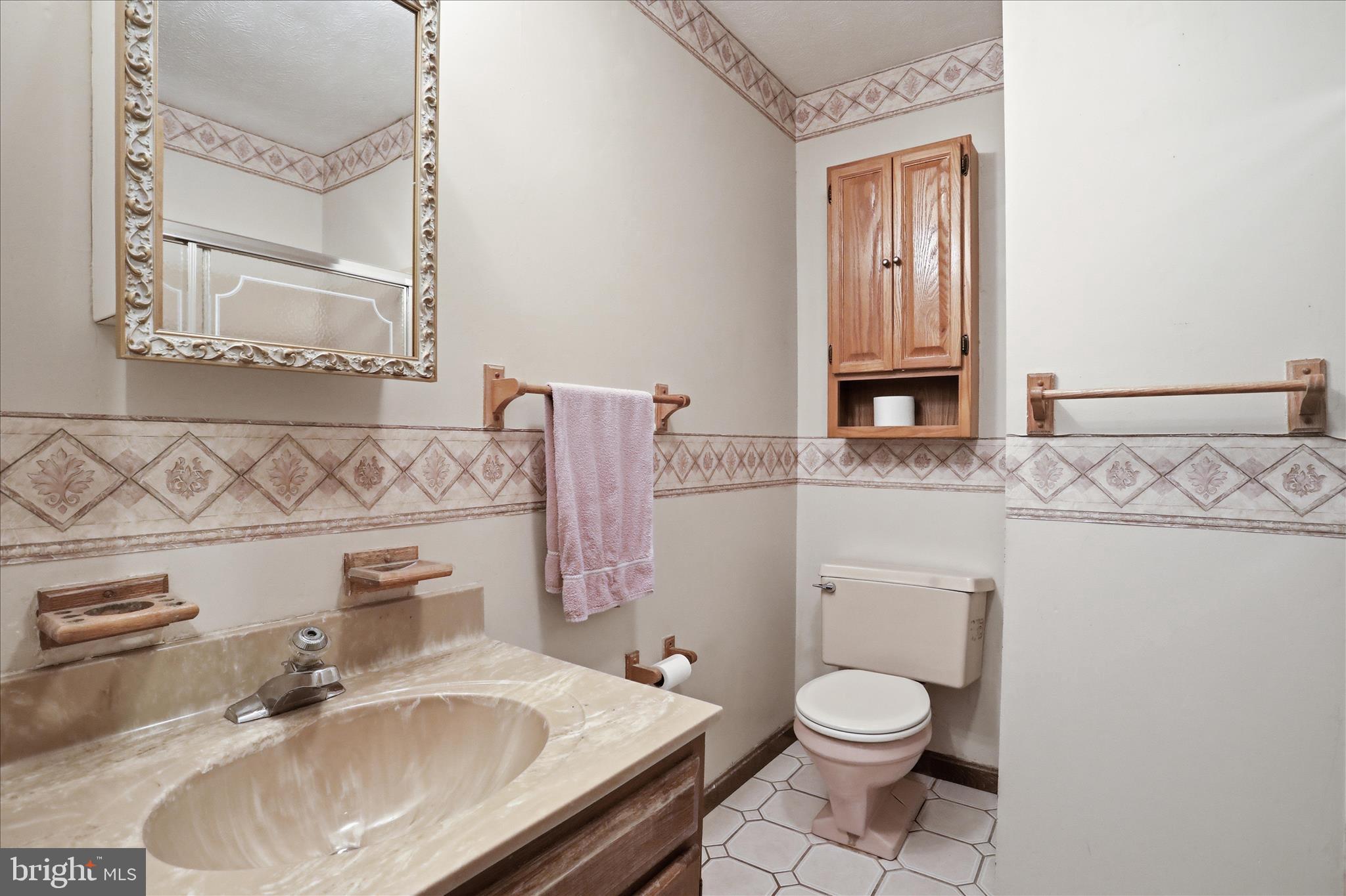 20 Gloucester Road Front Royal, VA 22630 - Photo 30 of 43 a bathroom with a granite countertop toilet sink and mirror
