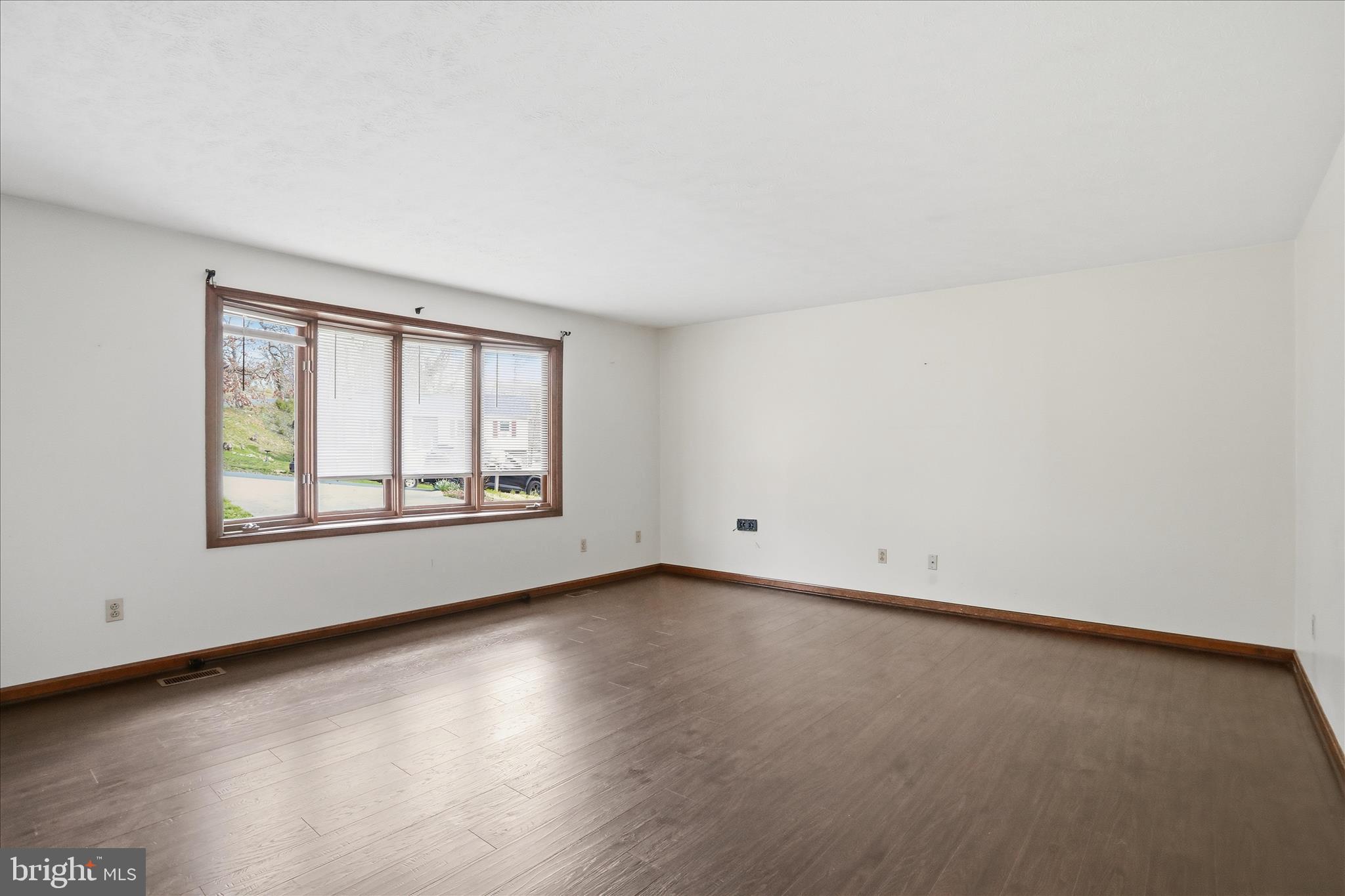 20 Gloucester Road Front Royal, VA 22630 - Photo 3 of 43 an empty room with wooden floor and windows