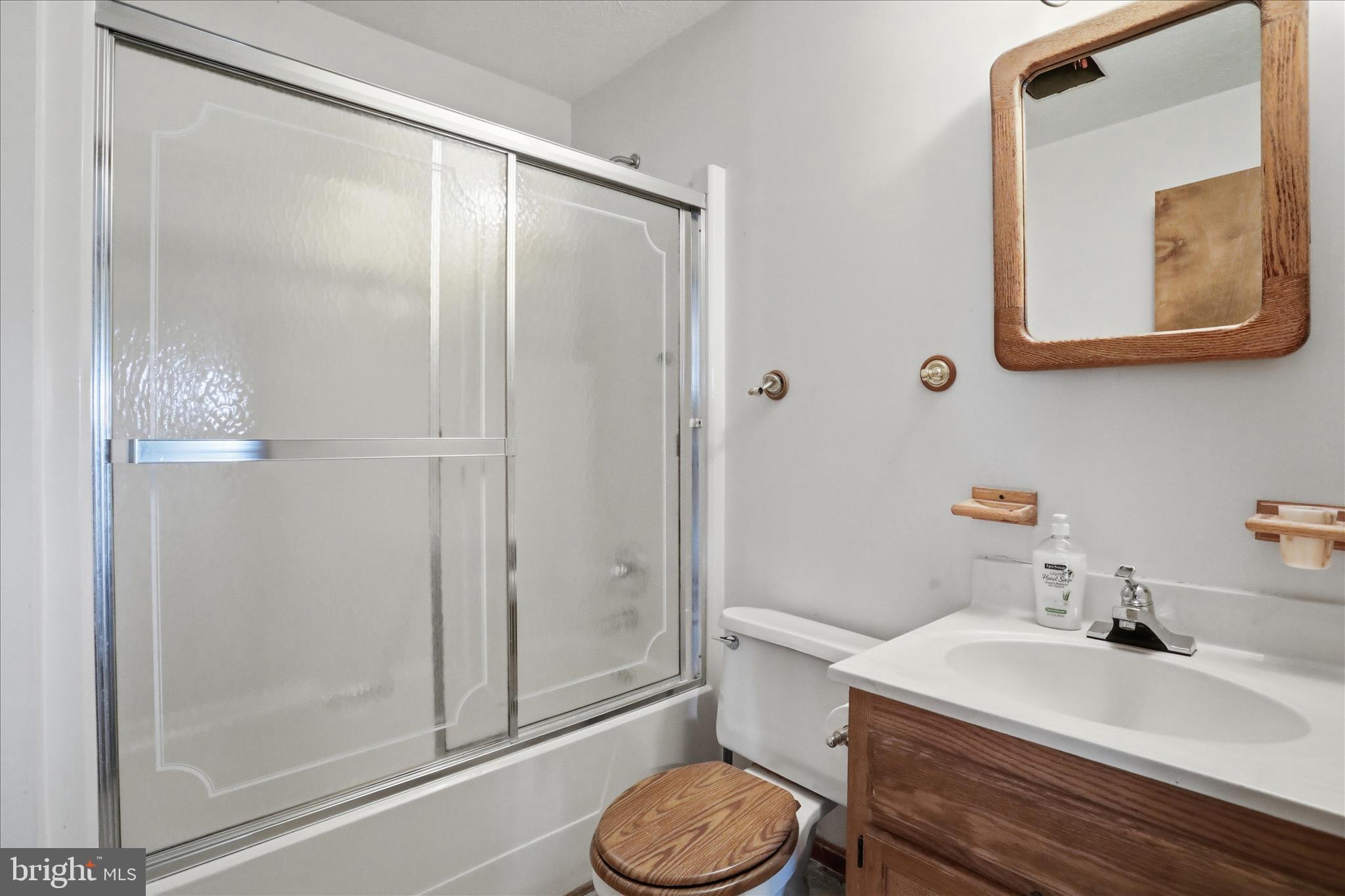 20 Gloucester Road Front Royal, VA 22630 - Photo 31 of 43 a bathroom with a sink vanity mirror and toilet