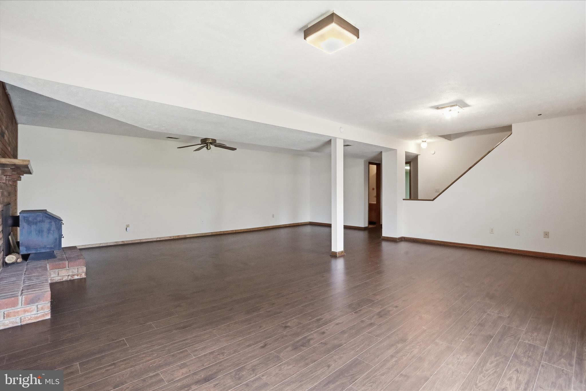 20 Gloucester Road Front Royal, VA 22630 - Photo 32 of 43 a view of a livingroom with wooden floor and stairs