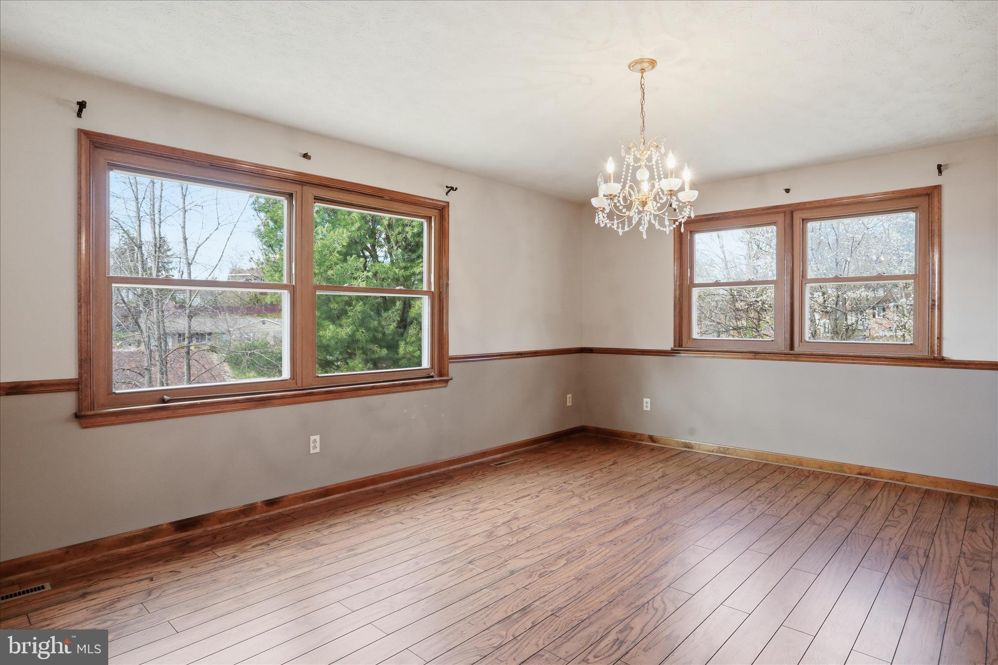 20 Gloucester Road Front Royal, VA 22630 - Photo 4 of 43 a view of an empty room with wooden floor and a window