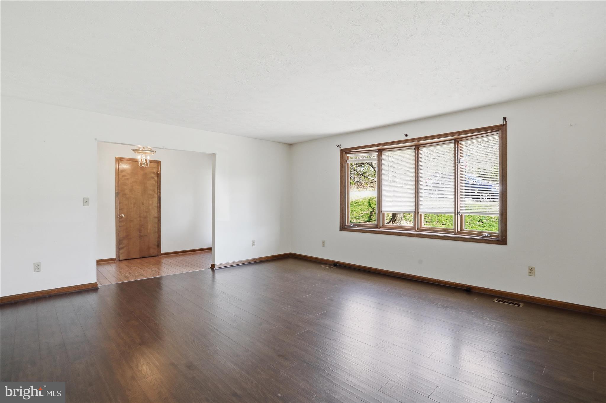 20 Gloucester Road Front Royal, VA 22630 - Photo 8 of 43 a view of an empty room with wooden floor and a window