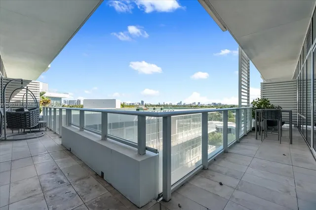 a view of a balcony with furniture