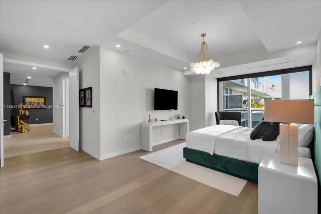 a spacious bathroom with a large tub sink and mirror