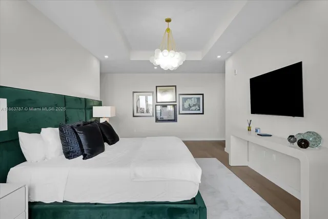 a bathroom with double vanity and a mirror