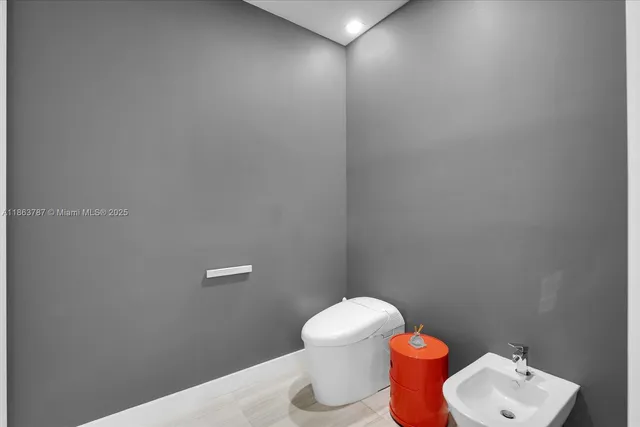 a utility room with sink dryer and washer