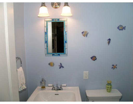 185 Rawson Road, Unit 3 Brookline, MA 02445 - Photo 13 of 18 a bathroom with a sink and a mirror
