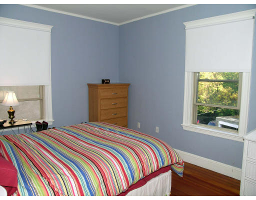 185 Rawson Road, Unit 3 Brookline, MA 02445 - Photo 14 of 18 a bedroom with a bed and a window