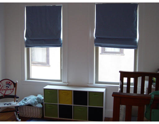 185 Rawson Road, Unit 3 Brookline, MA 02445 - Photo 16 of 18 a view of a bedroom with furniture and window