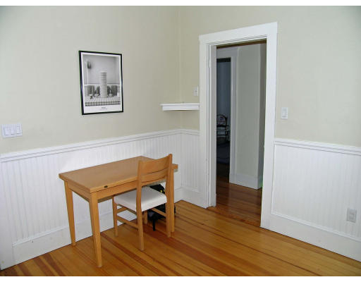 185 Rawson Road, Unit 3 Brookline, MA 02445 - Photo 4 of 18 a room with furniture and wooden floor