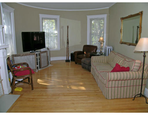 185 Rawson Road, Unit 3 Brookline, MA 02445 - Photo 10 of 18 a living room with furniture and a flat screen tv