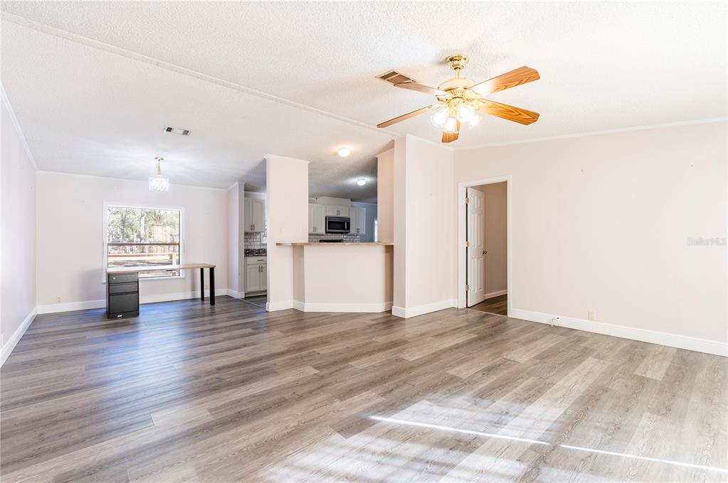 16314 Tiger Trail Spring Hill, FL 34610 - Photo 10 of 43 a view of a kitchen with a sink and a window