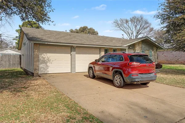 a car parked in front of a house