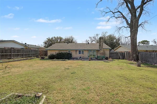 a swimming pool with outdoor seating and yard