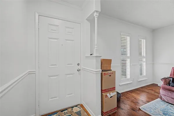 a view of a livingroom with wooden floor