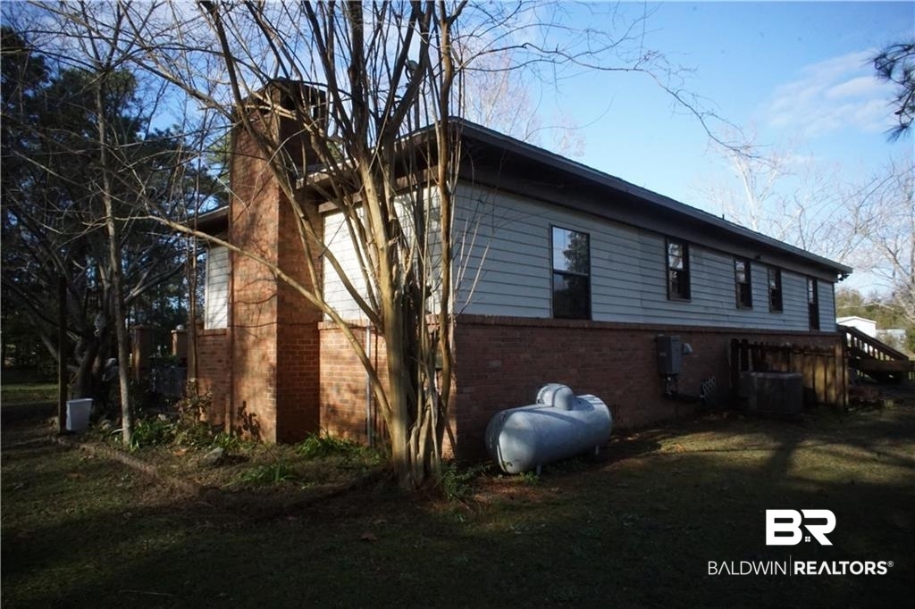 13301 A Hugh Fort Road Grand Bay, AL 36541 - Photo 25 of 34 View of property exterior featuring cooling unit