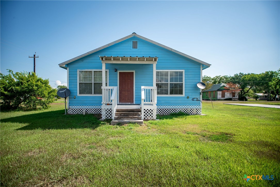 512 McDowell Street Austwell, TX 77950 - Photo 22 of 30 a view of a house with a yard and sitting area
